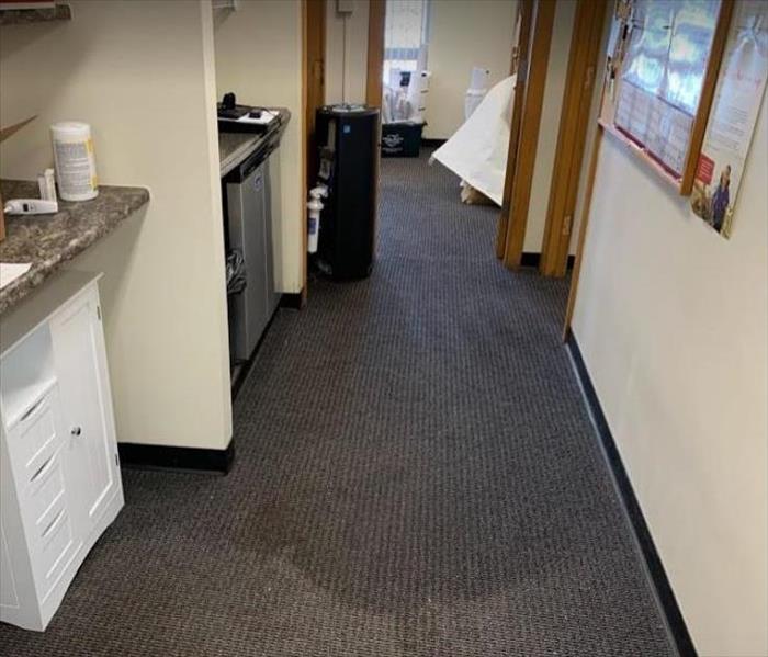 water damaged carpet in office