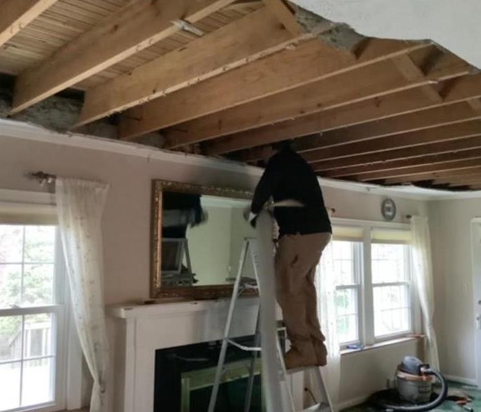technician removing ceiling