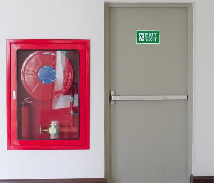 fire extinguisher and fire exit in building